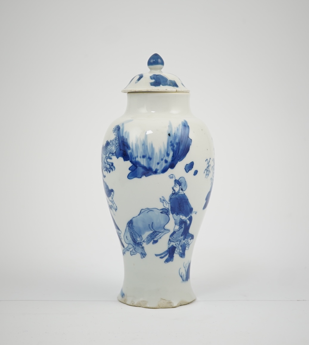 A Chinese blue and white baluster vase, early Kangxi, and associated cover